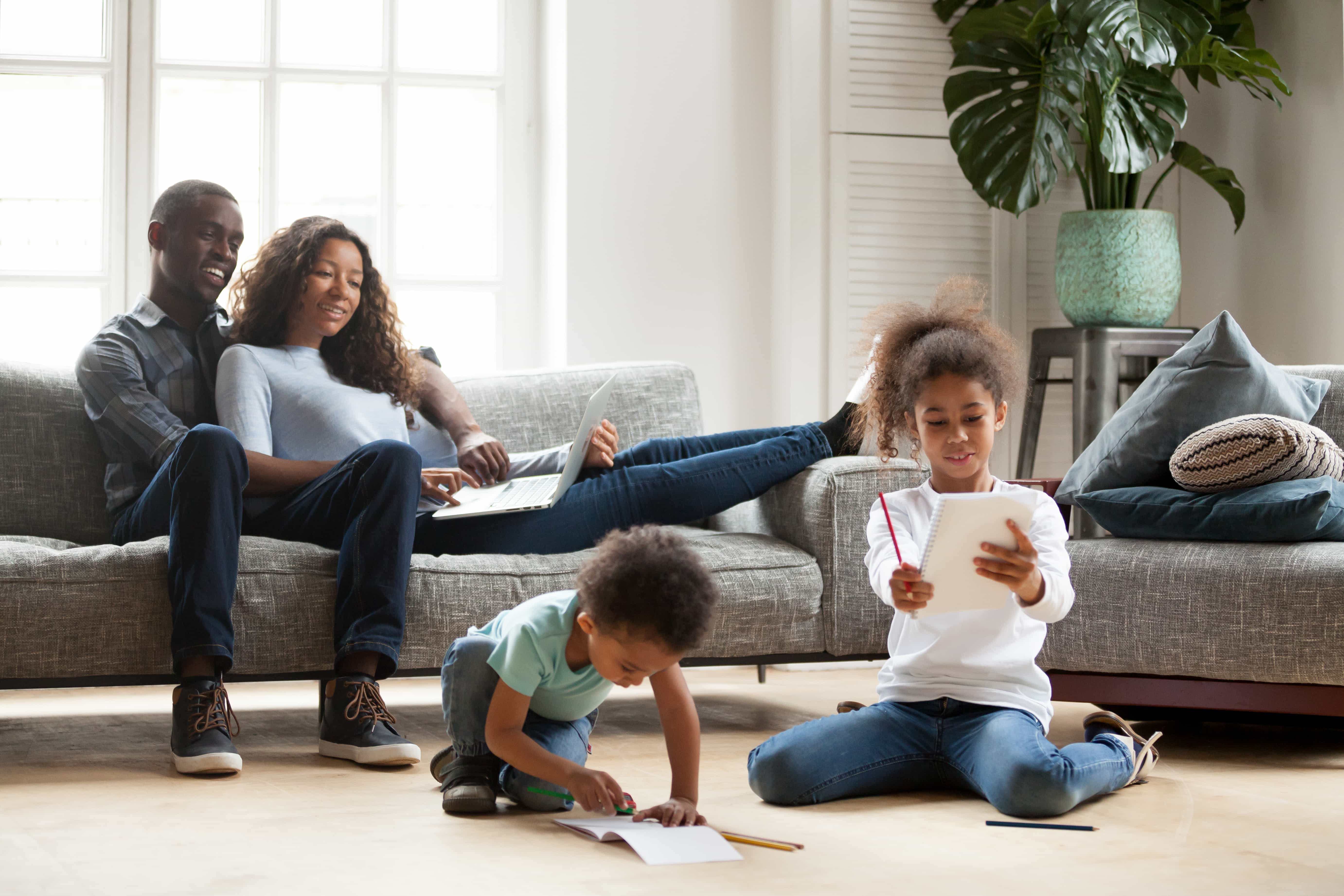 Young family with children doing homework